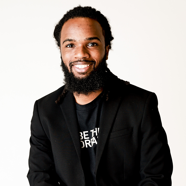Malik Yant, Aspire Lead Facilitator for Research and Data, smiling in a professional Aspire team headshot.